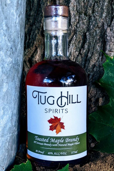Toasted Maple Brandy - Tug Hill Estates maple leaf outside brandy bottle liquor bottle