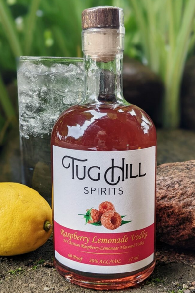 Raspberry Lemonade Vodka - Tug Hill Estates raspberries lemon ice water outside liquor bottle